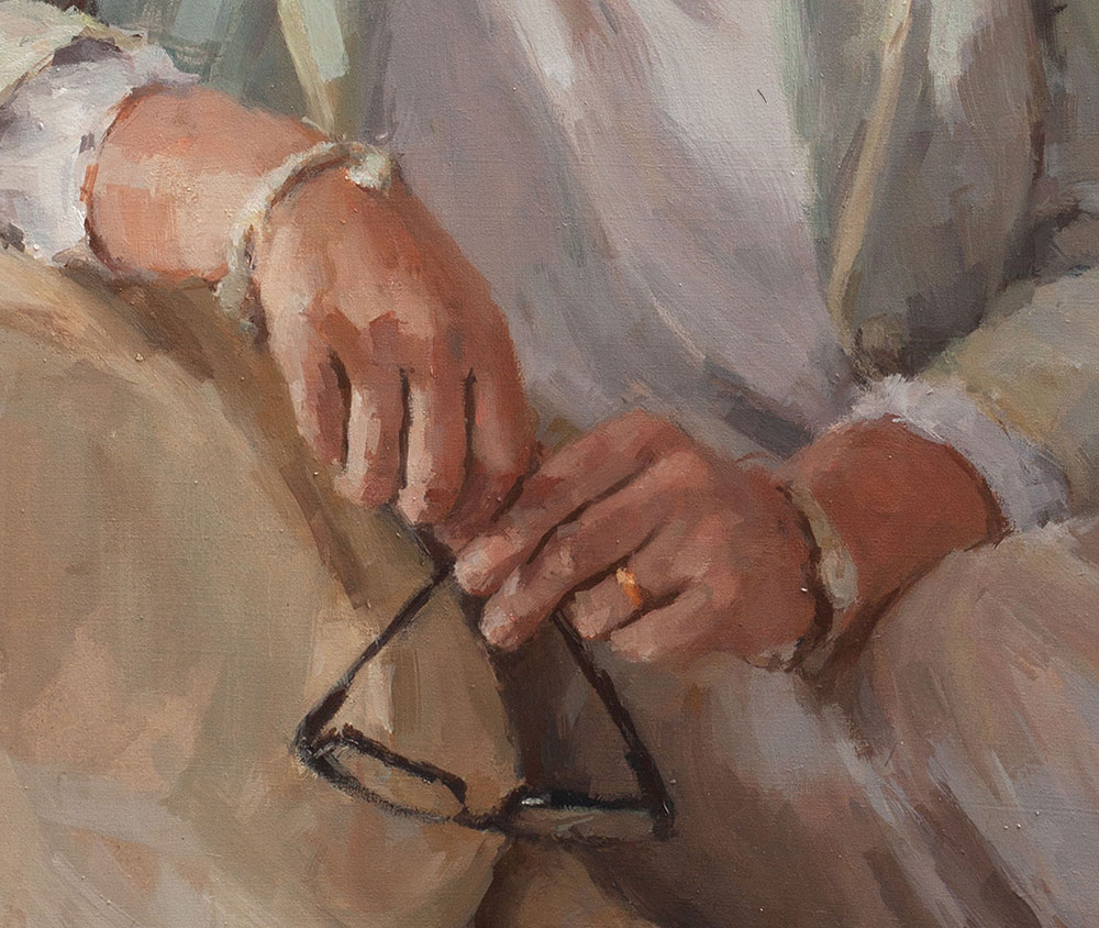 close up of hands on a portrait of a woman